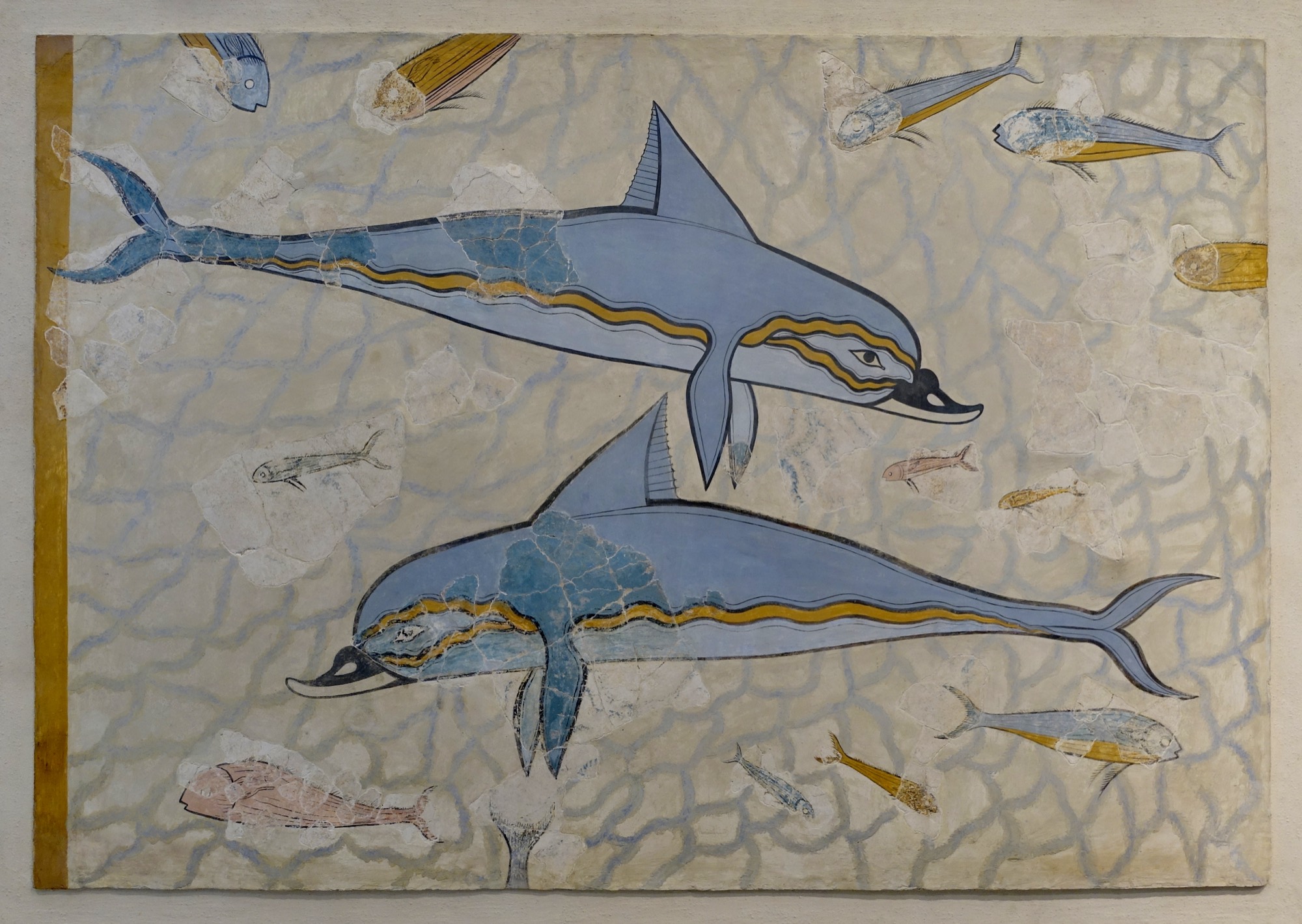 The Dolphin Fresco from the Palace of Knossos: blue dolphins with golden flanks gliding among small fish on a pale sea-blue ground.